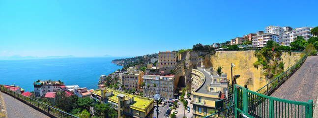 Wonderful panoramic view from the hill on the coast of Naples. Houses on the shore of the Gulf of Naples. Italy, Europe.