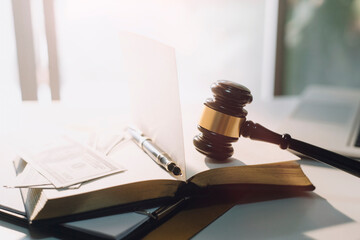 Business and lawyers discussing contract papers with brass scale on desk in office. Law, legal...