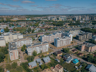 Residential neighborhoods of a Russian city. Typical house building. Residential areas with high-rise buildings