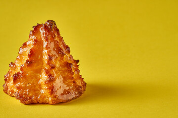 Cocada or coquito is a typical sweet throughout Latin America yellow background