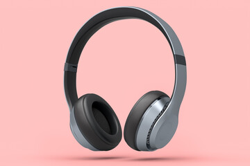 Fototapeta na wymiar Silver gaming headphones and concept of music equipment isolated on pink.