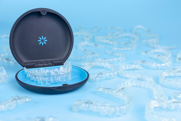 Invisible retainers case with orthodontic aligner brackets. Black plastic dental container for...