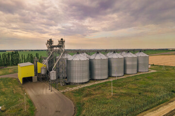 Grain silos elevator at the field. Grain storage in large silos aerial view © Leonid