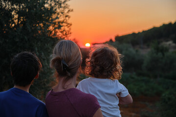 Mother and children watching the sunset