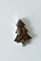 christmas tree and pine cones on a white background