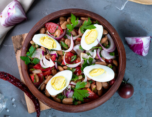 Classic Turkish dish piyaz on a gray background. Top view.