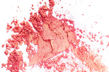 Peach and Gold colored pigment. Loose cosmetic powder. Coral eyeshadow pigment isolated on a white background, close-up