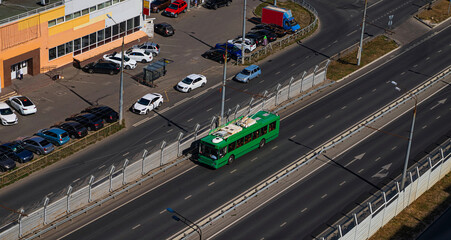  A modern low-floor trolleybus on the overpass. Ecologically clean transport of a modern city. 