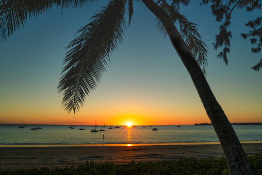 Silhouette of yachts anchored in ocean at sunset, Fannie Bay, Darwin, Northern Territory, Australia