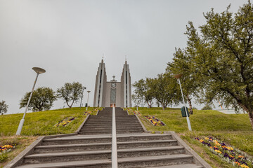 Church on the top of the hill in akureyri, iceland, a  big staircase leading to the church entrance.