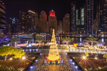 Shiny Christmas evening at the Dubai marina with lights shining from the beautiful tall buildings