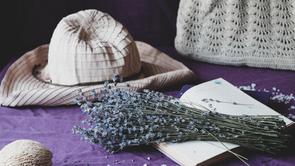 A bouquet of dried lavender on a violet table. Summer mood