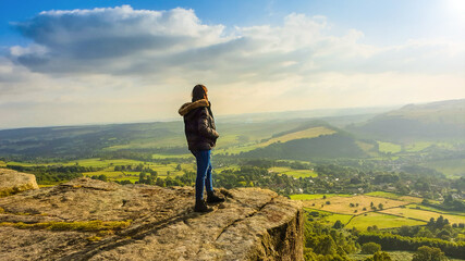 Person in the Mountains - On the Edge. Peak District, Curbar Edge