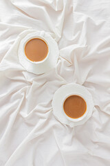 Cup of coffee with milk on white background. Cozy coffee break concept. Breakfast composition.