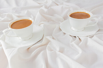 Cup of coffee with milk on white background. Cozy coffee break concept. Breakfast composition.