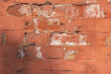 Old wall-  destroyed brick. Vintage background- cracks, chips