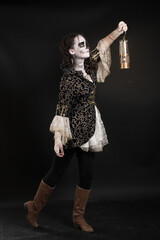 Young teenage girl dressed up for halloween as pirate ghost, wearing a victorian overcoat and lace