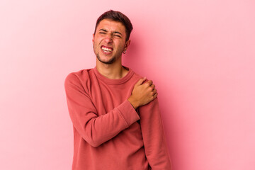 Young caucasian man with tattoos isolated on yellow background  having a shoulder pain.