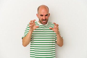 Naklejka premium Young bald man isolated on white background showing claws imitating a cat, aggressive gesture.