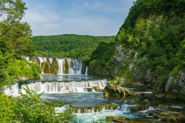 Fototapeta na wymiar Strbacki buk waterfall is one of the most beautiful waterfalls in Bosnia and Herzegovina, which is situated on the Una river.