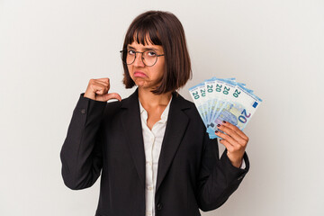 Young mixed race business woman holding a banknotes isolated on white background feels proud and self confident, example to follow.