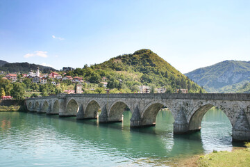 Fototapeta na wymiar Old stone bridge in Visegrad, built in 1571 by Mehmed Pasha Sokolovic, Bosnia and Herzegovina