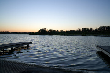 Fototapeta premium Scenic View of Illinois Golden Hour Lake Sunset with two docks 