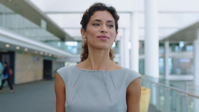 confident business woman walking in airport smiling independent female executive enjoying successful corporate career 4k footage
