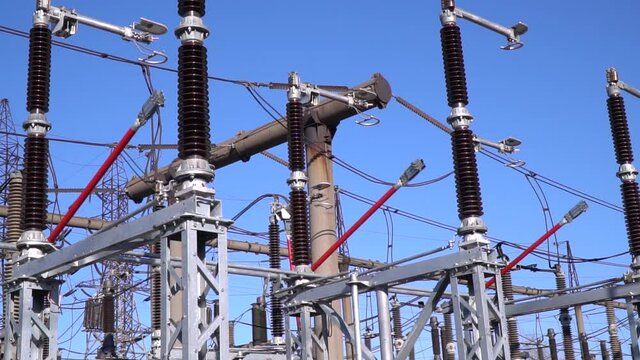 Beautiful blue sky in the background of a transformer with cables, electricity