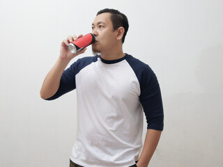 Asian man drinking soda soft drink