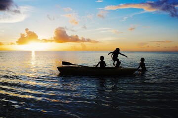 Children Playing on a Canoe - Hagatna Sunset