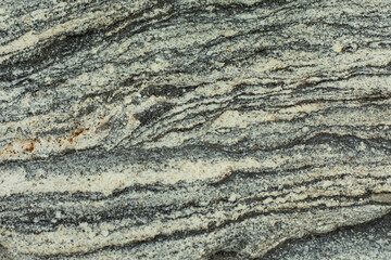 The texture of the stone. The surface of the rock is in detail. Beautiful background natural rock.