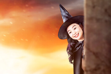 Asian witch woman with a hat standing