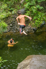 Kids Swimming, Jumping, and Playing in theʻ ĪAO VALLEY STATE MONUMENT in Maui, Hawaii, and Falling from a High Ledge