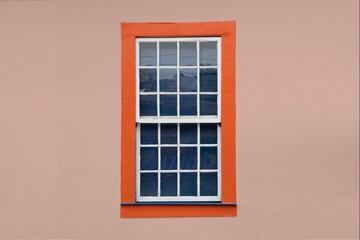 Brazilian colonial house window in a orange wall