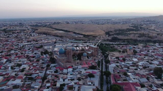 Aerial View Of Registan Square And Afrasiyab Settlement In Samarkand, Uzbekistan At Dusk.
