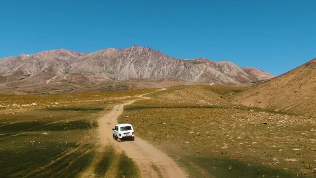 Speed Vehicle In An Off-Roading Trail In Arashan Lakes, Namangan, Ferghana Valley, Uzbekistan. - Aerial Tracking