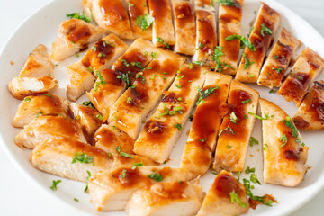 grilled chicken breast sliced on plate
