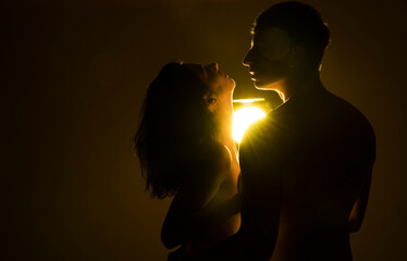 silhouette of a couple. Sexy couple. Erotica. Man and woman. Sensual. Photo. Idea. Passion. 