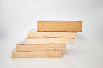 stacks of books on white background high angle view