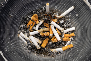 The cigarette butt after smoking is placed in the ashtray of the smoking area. Many cigarette butts in the ashtray are caused by people who are fond of smoking nowadays, nicotine causes cancer