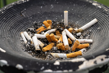 The cigarette butt after smoking is placed in the ashtray of the smoking area. Many cigarette butts in the ashtray are caused by people who are fond of smoking nowadays, nicotine causes cancer
