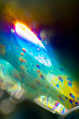 Obraz na płótnie Canvas View into a microscopic world of soap bubbles, uncovered light, artistic multicolored surreal detail.