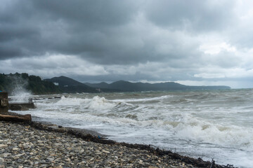 storm on the black sea, waves crashing on the shore, brown water