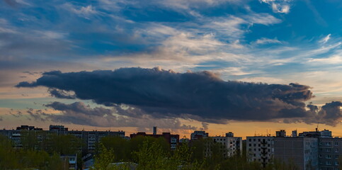 Cloud over the city at sunset in summer