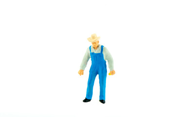 Miniature farmer people isolated with clipping path on white background . Elegant Design with copy space for placement your text, mock up for farmer and gradening concept.