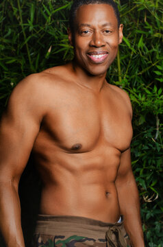 Portrait of shirtless, athletic Black man 