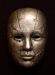 Robot Face Mask Isolated Against Brown Background