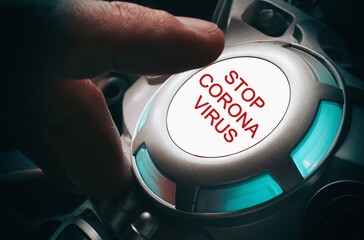 Finger about to press a car ignition button with the "stop coronavirus" . Composite image between a hand photography and a 3D background.