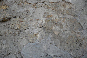 Old dirty wall close up. Grunge abstract photo background.  Beautiful stone texture pattern.
